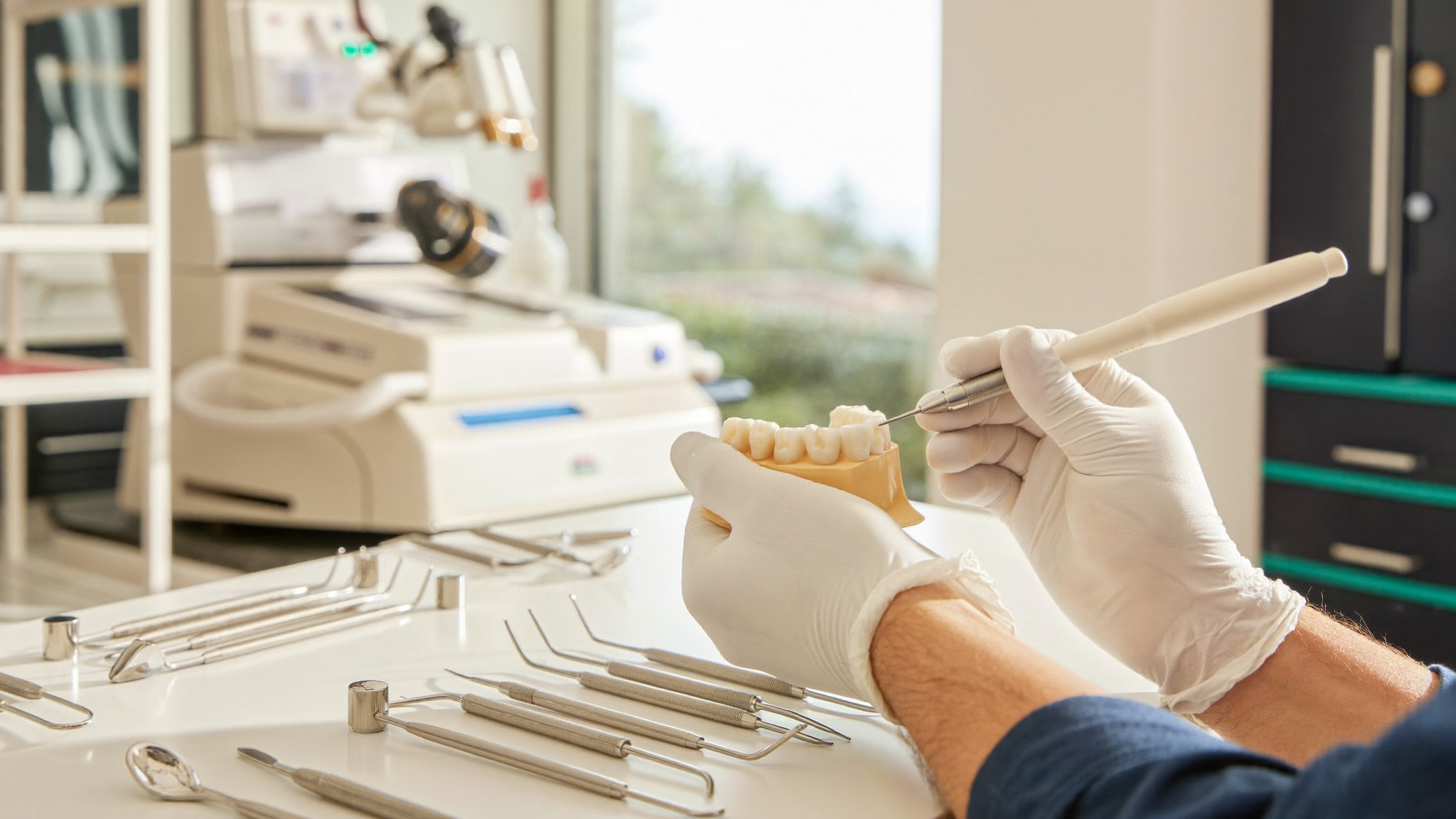 Technician finishing a ceramic restoration in the on-site dental laboratory at Palm Beach Institute of Dentistry in West Palm Beach