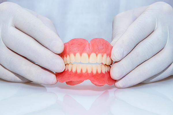 Adjusting To New Dentures: What To Consider When Caring For Your Dentures